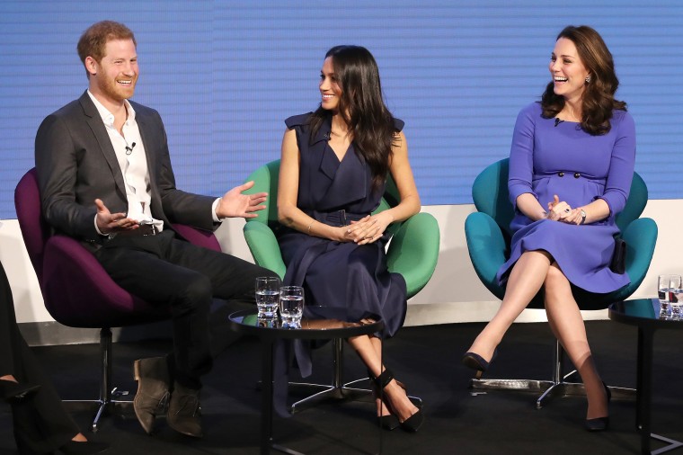 Prince Harry, Meghan Markle and Catherine, Duchess of Cambridge attend the first annual Royal Foundation Forum held at Aviva on February 28, 2018 in London. Under the theme 'Making a Difference Together', the event will showcase the programs run or initiated by The Royal Foundation. Markle wore a a belted blue satin wrap dress by Jason Wu with Aquazzura's Casablanca Pumps in black.