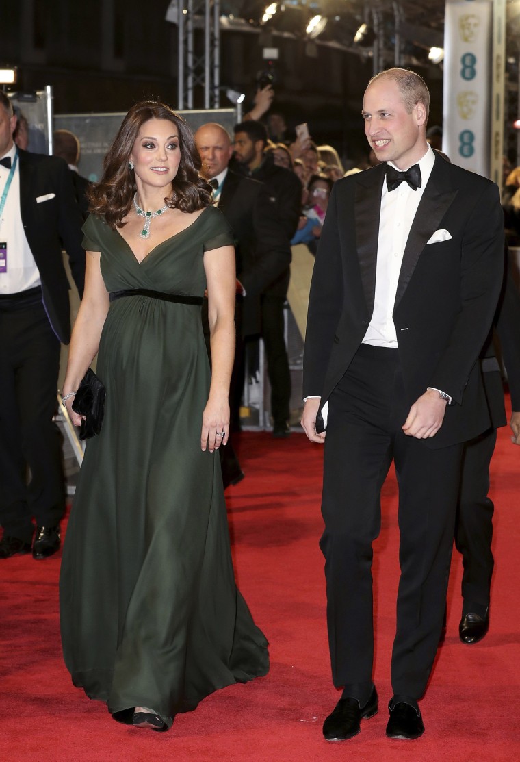 Britain's Prince William and Kate, Duchess of Cambridge arrive for the BAFTA 2018 Awards in London, Sunday, Feb. 18, 2018. The duchess wore an elegant forest green Jenny Packham dress, paired with a dazzling diamond and emerald necklace, bracelet and earring set.