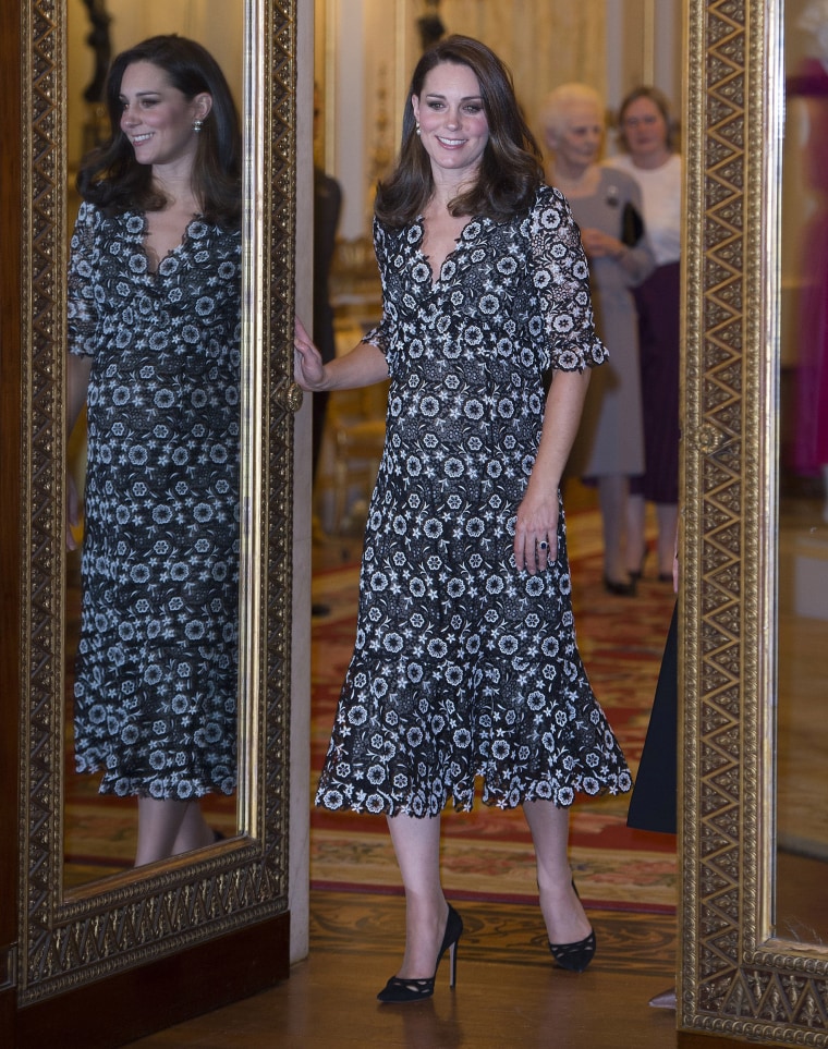 Catherine, Duchess of Cambridge attends The Commonwealth Fashion Exchange Reception at Buckingham Palace on February 19, 2018 in London. She wore a black and white floral-printed Erdem gown.