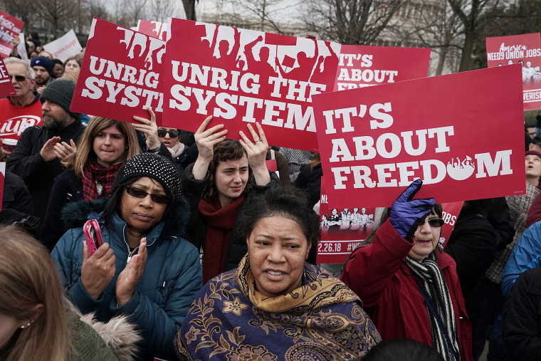 Image: Activists rally in front of the U.S. Supreme Court