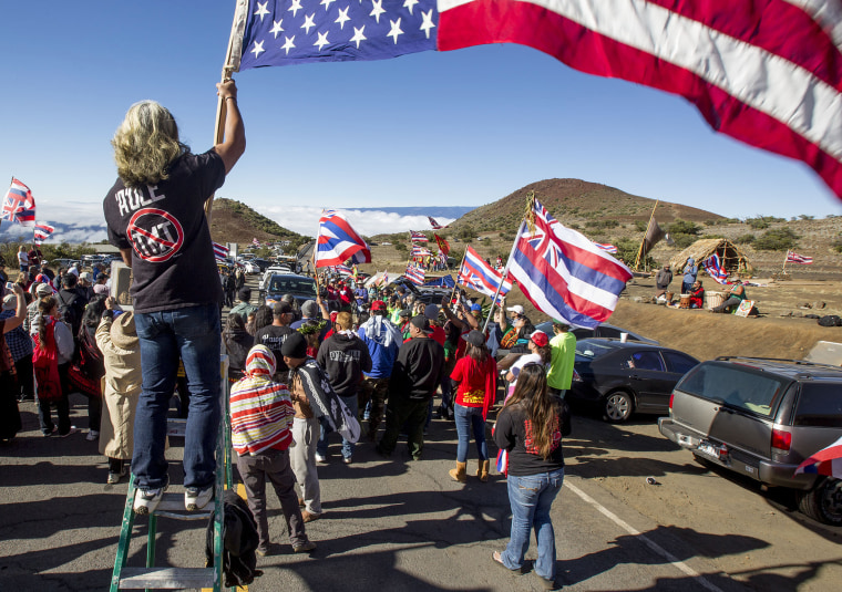 Protesters block the road near the Thirty Meter Telescope construction site on June 24, 2015, atop Mauna Kea.