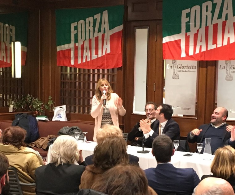 Image: Alessandro Mussolini, 55, granddaughter of Italy's wartime fascist leader Benito Mussolini, is greeted by supporters at a campaign event in Rome for Silvio Berlusconi's center-right Forza Italia party on Feb. 22. 