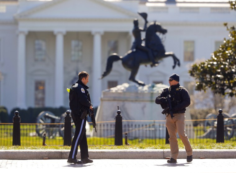 Image: Law enforcement officers at Lafayette Park across from the White House in Washington, close the area to pedestrian traffic, on March 3, 2018.