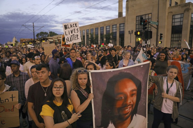 Image: Supporters of Philando Castile hold a portrait of Castile as they march along University Avenue in St. Paul, Minnesota, leaving a vigil at the state Capitol on June 16, 2017.