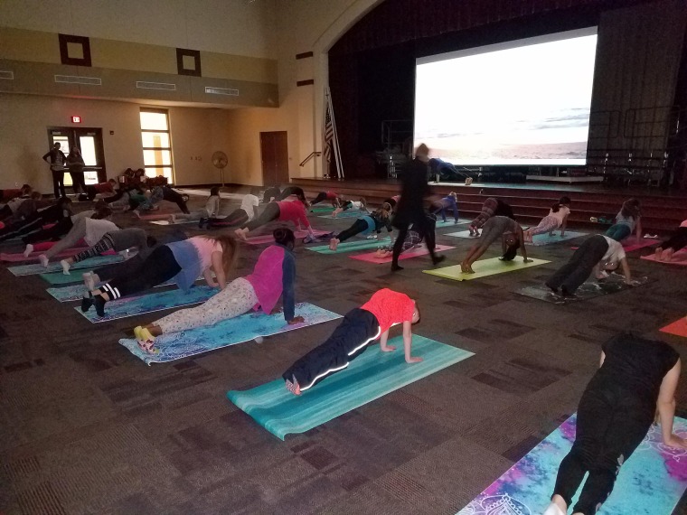 Tina DuBrock realized her students experienced loads of stress, even starting in kindergarten. She started a yoga program and were stunned that 120 students showed up for it.