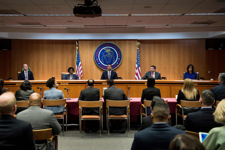 Image: FCC Chairman Ajit Pai and commission members take their seats