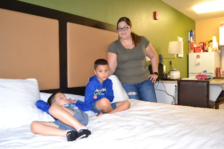 Jackeline Soto Perez, with her two young sons, at the Miami hotel where they are staying through FEMA's Transitional Shelter Assistance program, March 5, 2018.