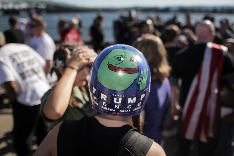 Jaeda Ferrel wears a helmet adorned with a hand-painted image of Pepe the frog and a Trump/Pence sticker at a rally organized by the right-wing group Patriot Prayer in Vancouver