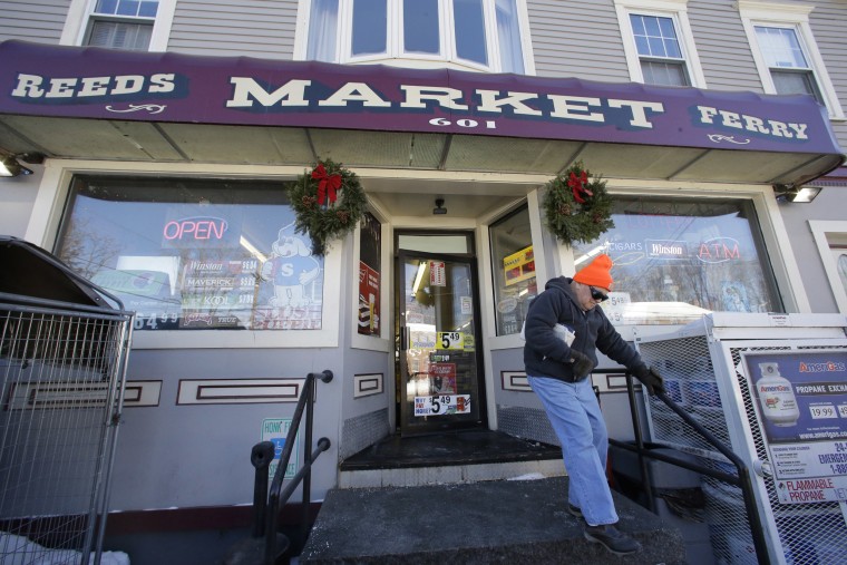 Image: A customer departs Reeds Ferry Market convenience store