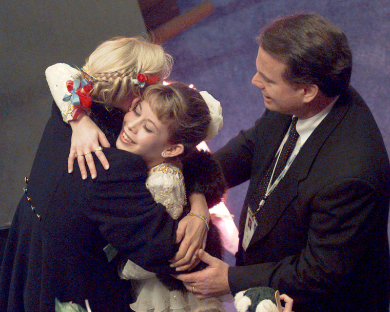 Image: Ladies figure skater Tara Lipinski with her coach Richard Callaghan