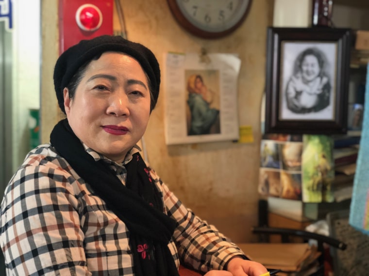 Image: Bae Jum Ye, 66, owns the "Olympic Coffee Shop" in the Seoul district of Jongno