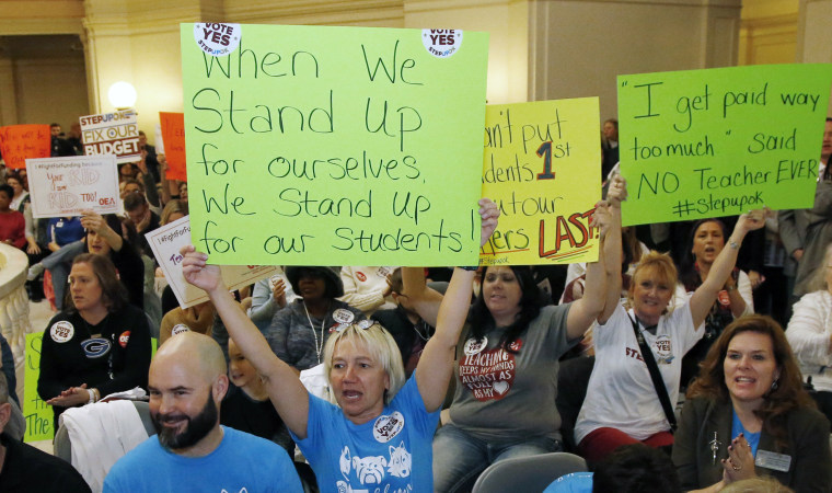 Image: Edmond school counselor Wendy Joseph, left, cheers with other supporters of the teacher pay raise