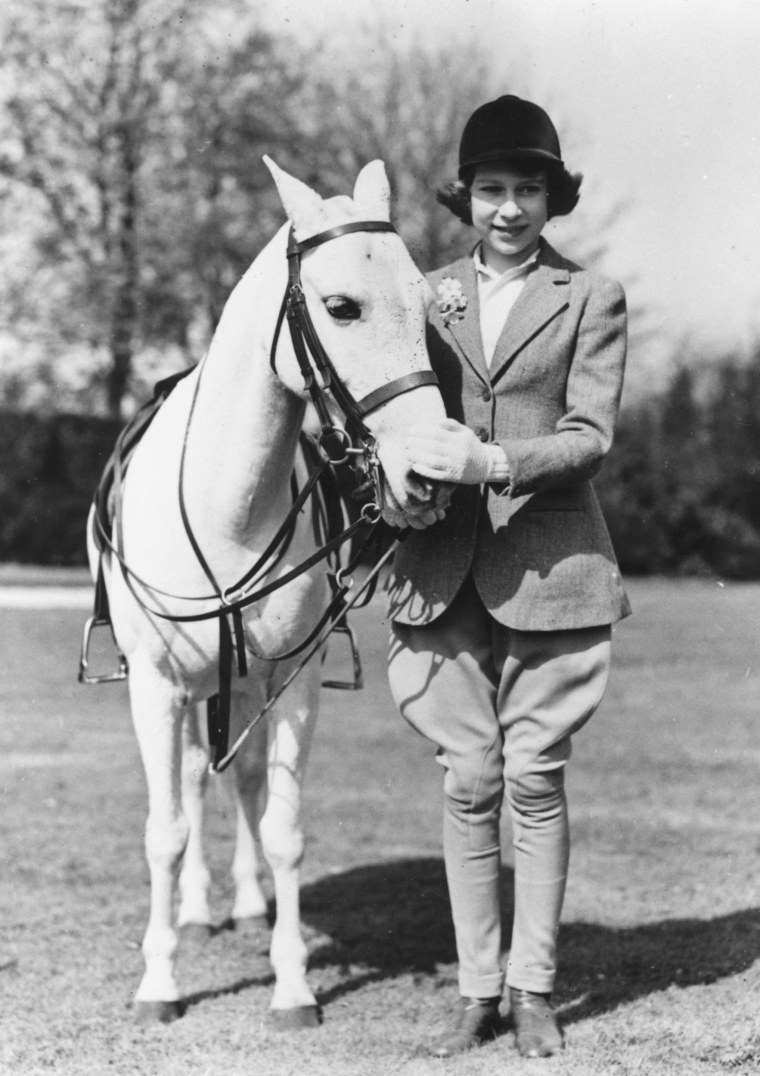 Princess Elizabeth stands next to her horse at Windsor on her 13th birthday on April 21, 1939.