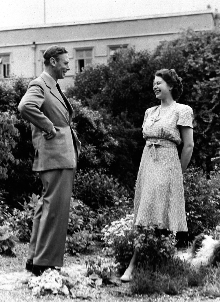 Princess Elizabeth, right, laughs with her father King George VI, in the grounds of the Royal Lodge, Windsor.