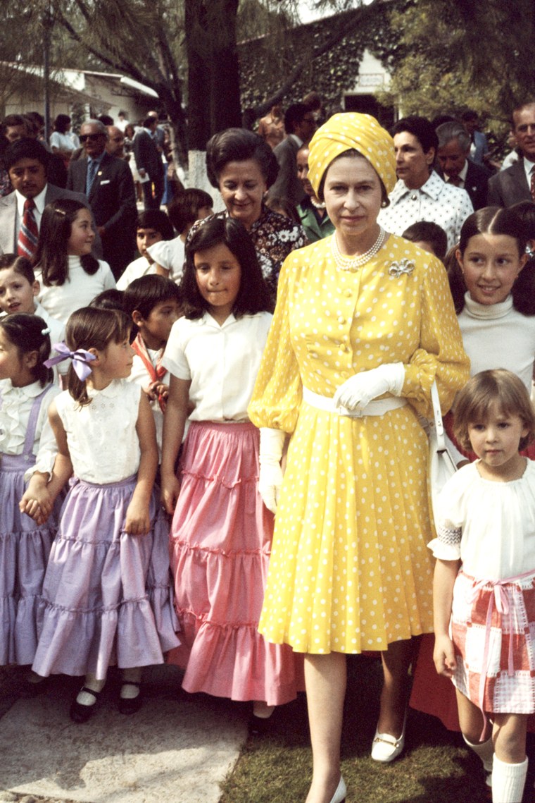 Queen Elizabeth turned heads in a yellow dress and matching turban during a state visit to Mexico in 1975. Turbans were a popular accessory choice for the queen who is rarely seen in public without a head covering.