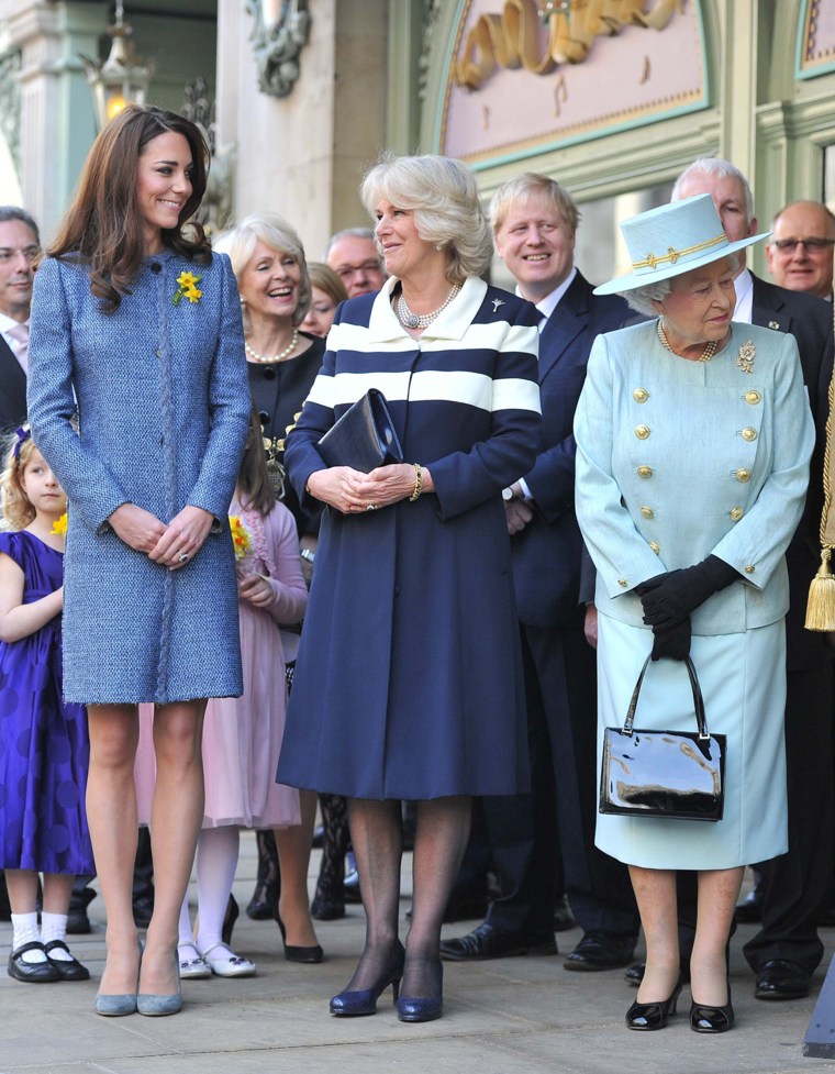 Catherine, Duchess of Cambridge, Camilla, Duchess of Cornwall and Queen Elizabeth await ahead of a plaque unveiling, as London Mayor Boris Johnson (2nd R) looks on outside Fortnum & Mason store on March 1, 2012 in London. Together with Camilla, Duchess of Cornwall and Catherine, Duchess of Cambridge, the Queen met military personnel and staff, viewed the store's Diamond Jubilee product ranges and unveiled a plaque for the regeneration of Piccadilly.