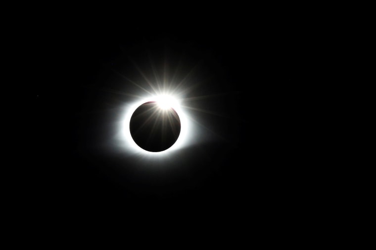 Image: The solar eclipse creates the effect of a diamond ring at totality as seen from Clingmans Dome in the Great Smoky Mountains National Park, Tennessee