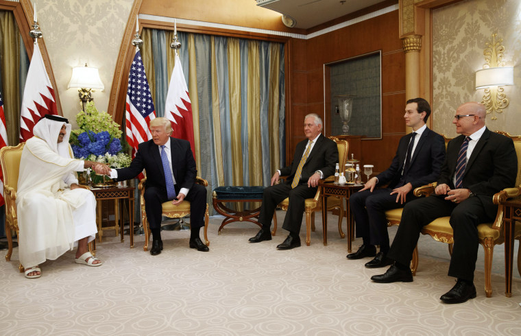Image: Trump shakes hands with Qatar's Emir