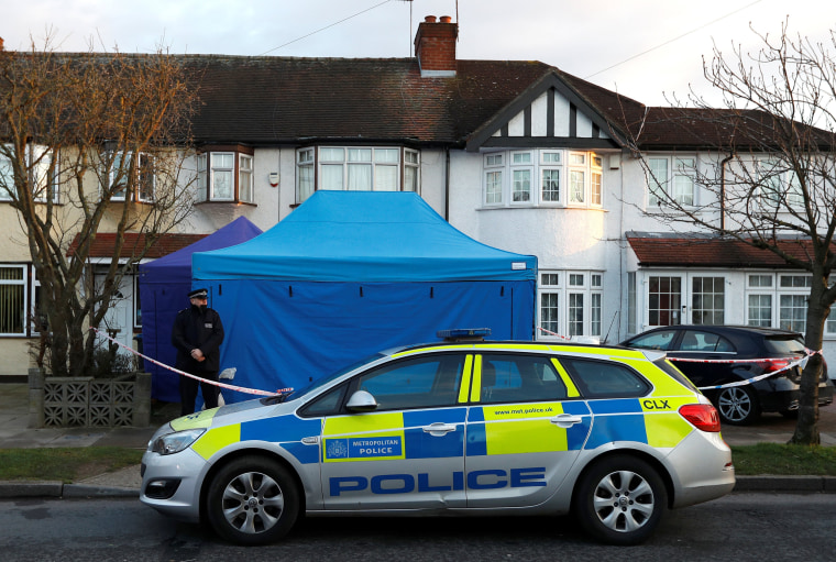 Image: A police officer stands guard outside the home of Nikolai Glushkov