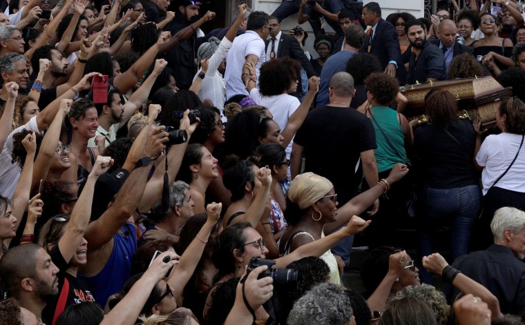 Demonstrators react as Franco's body arrives at the city council chamber.