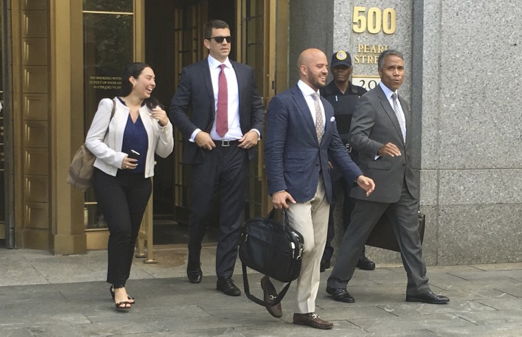 Image: Jonathan Roper Fernando Serrano walk with Serrano?s lawyer Jude Cardenas after they pleaded not guilty in Manhattan New York