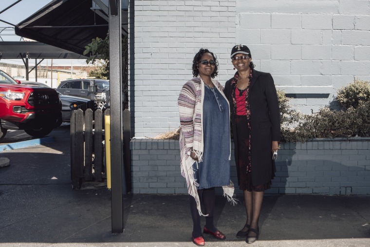 Image: Cassandra Gooley, left, and Cynthia Ray, right, stand for a portrait after having lunch at Niki's West in Birmingham, March 14, 2018. African-American women are running in higher numbers in Jefferson County, Alabama.