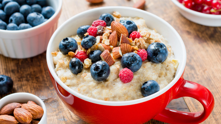 Oatmeal porridge with fruits and nuts for healthy breakfast