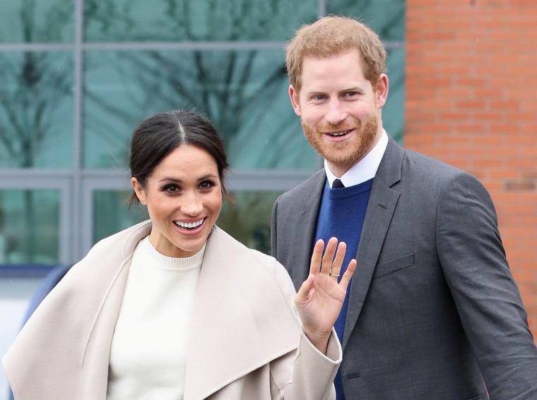 The fiancee of Britain's Prince Harry, Meghan Markle, reacts after a visit to a science park called Catalyst Inc., in Belfast