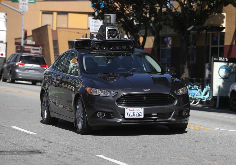 Image: An Uber self-driving car drives down 5th Street in San Francisco