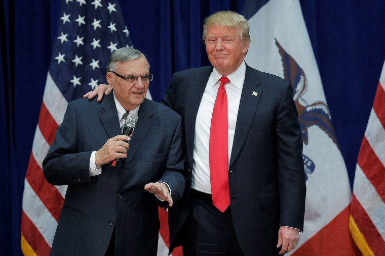 Image: Republican presidential candidate Donald Trump is joined onstage by Maricopa County Sheriff Joe Arpaio at a campaign rally in Marshalltown