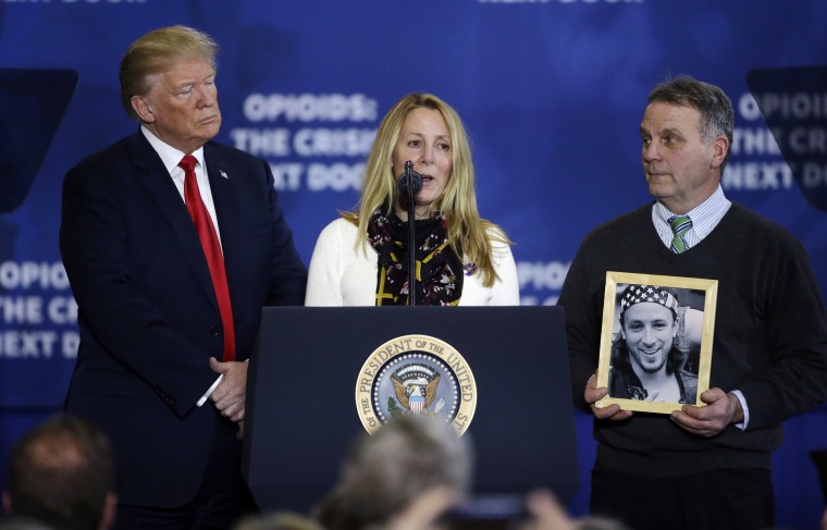Image: Trump listens as Jeanne and Jim Moser speak about their son