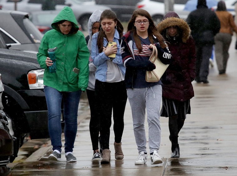 Image: Students from Great Mills High School walk to meet their parents