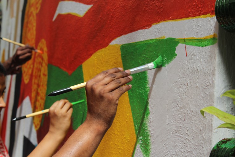 Transgender women painting a mural in Bangalore, India, in March 2018.