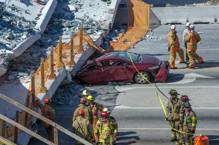 Image: A pedestrian bridge collapses crushing vehicles underneath in Miami