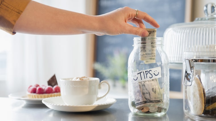 Image: Traditional tip jars have disappeared, in favor of tips made on credit cards.