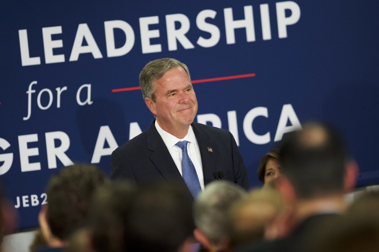 Image: Jeb Bush reacts as he announces the suspension of his presidential campaign