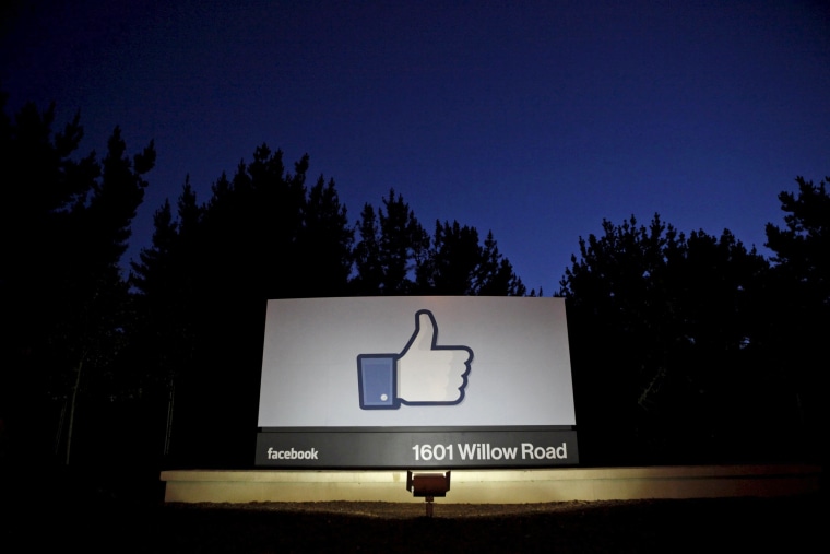 Image: The sun rises behind the entrance sign to Facebook headquarters in Menlo Park before the company's IPO launch,