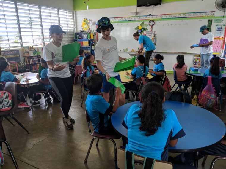 Former White House officials visit an elementary school in Comunidad Isaac Del Rosar in Puerto Rico.