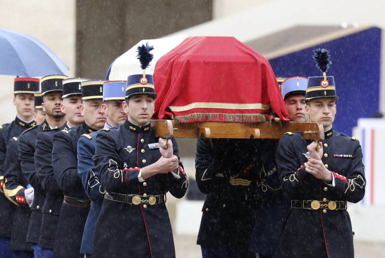 Image: French Republican Guards and cadets from the joint-army military school carry the coffin