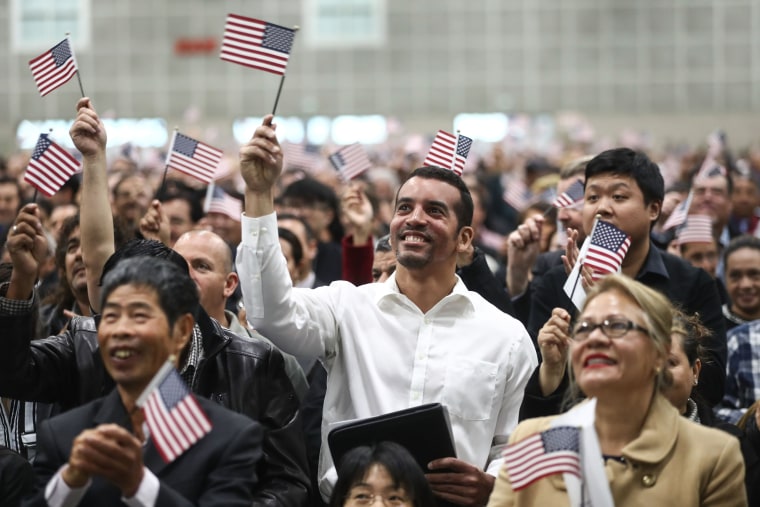 Image: Thousands Of Immigrants Are Naturalized In Citizenship Ceremony At  L.A. Convention Center