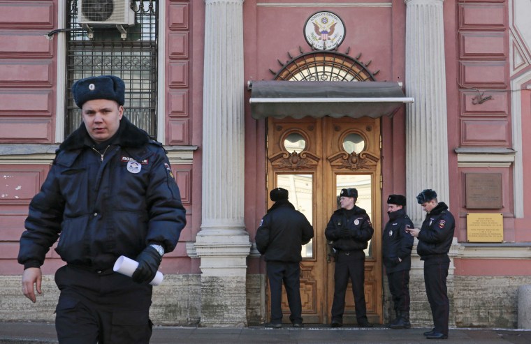 Image: Policemen stand guard outside the building of the consulate-general of the U.S. in St. Petersburg