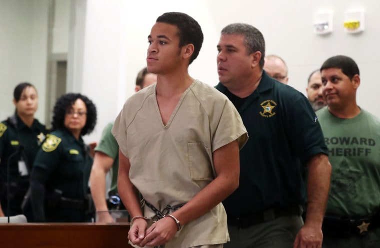 Image: Zachary Cruz, 18, brother of Nikolas Cruz, walks into Broward court for a bond hearing in Fort Lauderdale