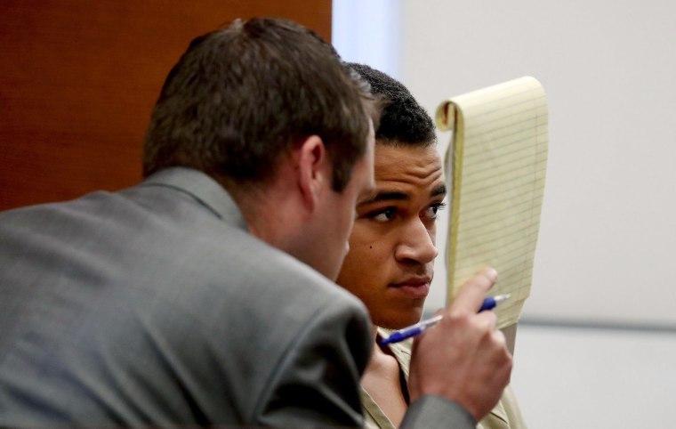 Image: Zachary Cruz, 18, brother of Nikolas Cruz, who killed 17 people at Marjory Stoneman Douglas High School last month, speaks with his attorney Joseph Kimok as he waits for his bond hearing to begin in Broward court in Fort Lauderdale