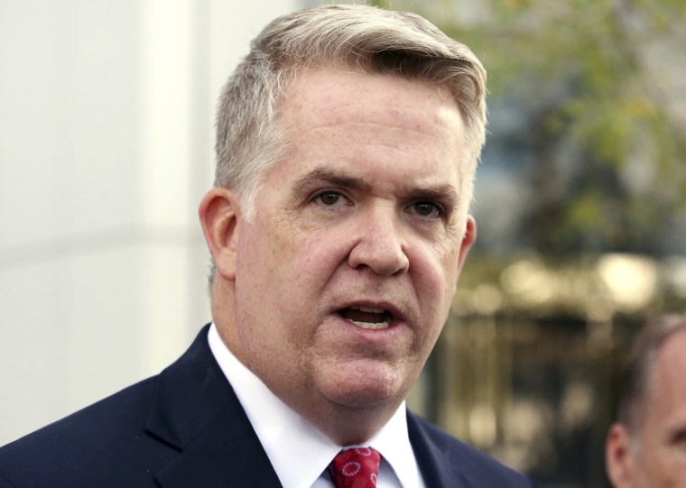 Image: John W. Huberspeaks outside the federal courthouse