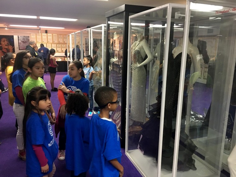 Image: Children admiring exhibits at the Selena museum in Corpus Christi, Texas.