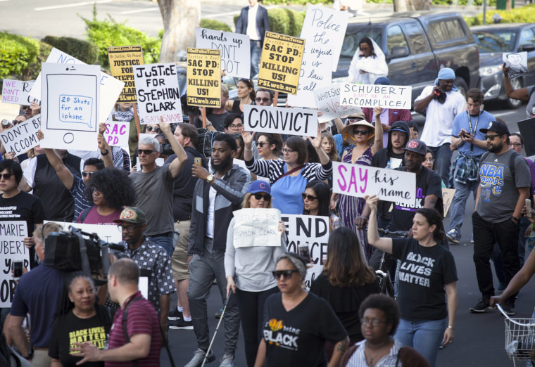 Image: Protesters march through the streets after the funeral of Stephon Clark in Sacramento