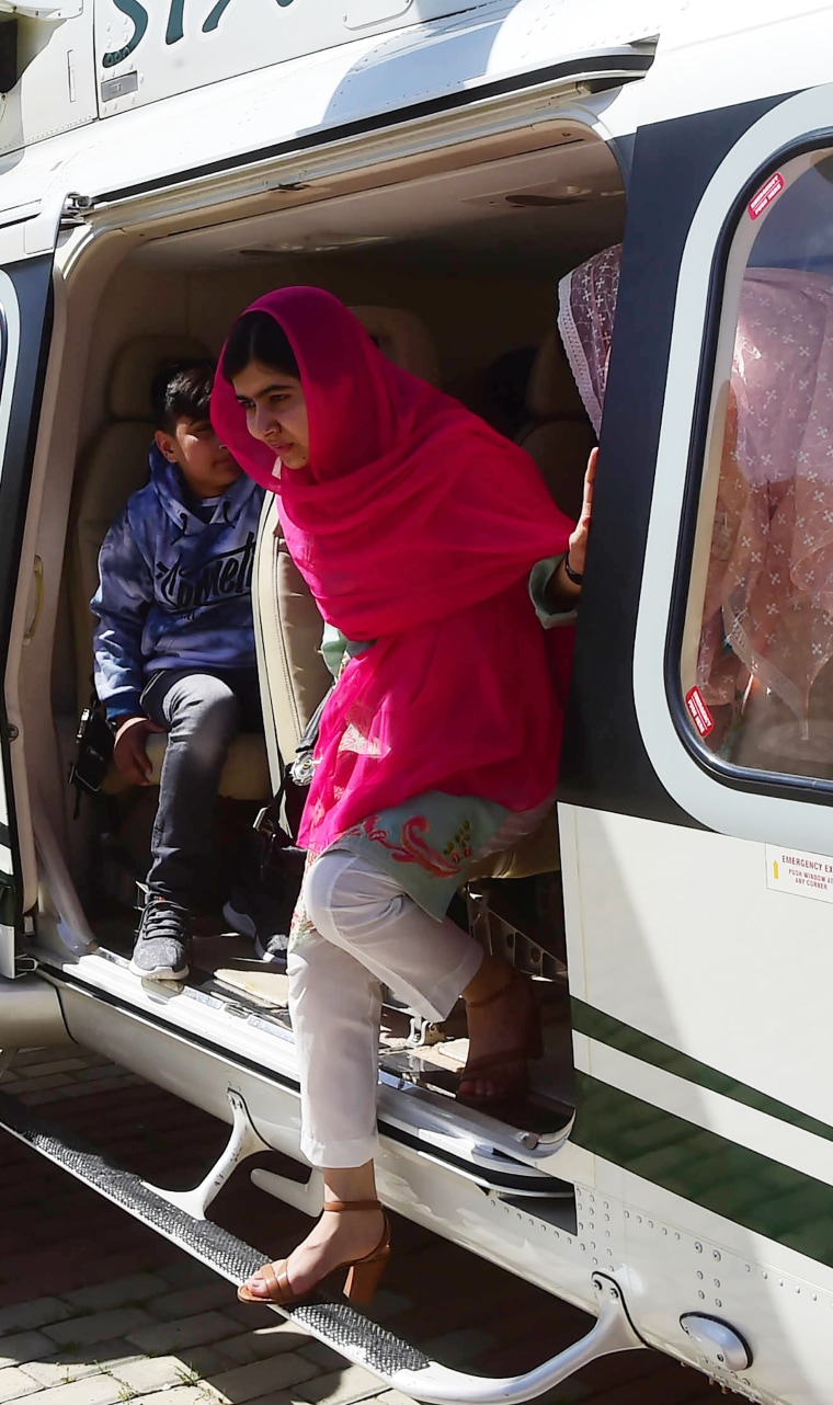 Image: Malala steps out of a helicopter into the region where she was shot in the head more than five years ago.