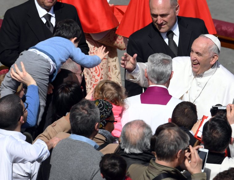 Image:Pope Francis meets a boy in the crowd after Easter Sunday mass at Vatican City.