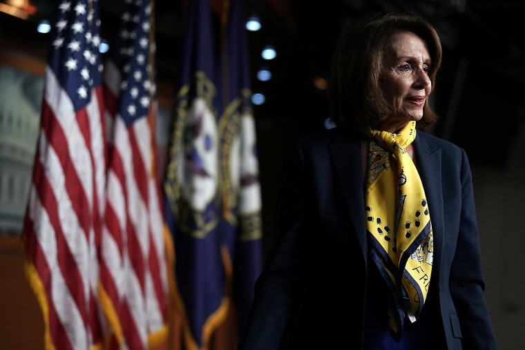 Image: House Minority Leader Rep. Nancy Pelosi leaves after a weekly news conference