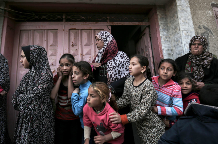 Palestinian relatives of Ibrahim Abu Shaer mourn during his funeral on March 31.